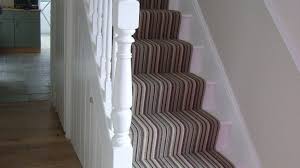 The stairway perfectly frames a gallery wall filled with a playful mix of contemporary art pieces and antique photographs. Halls Stairs And Landings Style Within