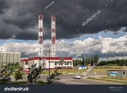 Industrial Factory Plant Chimney Smoke Stack In The Boiler Room On The Background Of Black Thunderclouds Bad Weather Industrial Factory Room With Plants Boiler