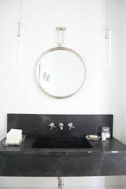 Gorgeous black and gold powder room boast a gold towel rack hanging on black lacquered walls illuminated by a black and gold down turned a dark paneled jib door opens to a hidden powder room boasting blue walls lined with a dark stained washstand paired with a honed white marble countertop. 12 Powder Room Ideas In Marble Beautiful Bathrooms Bathroom Design Bathroom Inspiration
