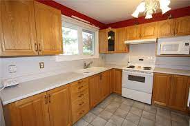 Durable but hard to stain. Downplay Honey Oak Cabinets