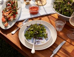 Each place setting featured a blue melamine dinner and salad plate from q squared. Spring Greens Salad Recipe Goop