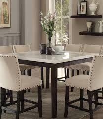 This dining table set consists of one table and two dining stools. Buy Acme Nolan 72855 Counter Dining Set 5 Pcs In Black White Linen Online