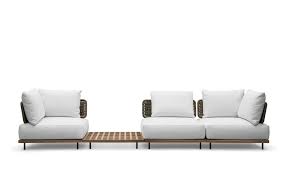 The full set is modular and includes a five seat sofa, three ottomans, and a matching teak coffee table. Quadrado Sofas En