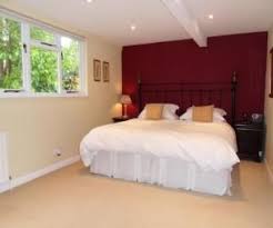 Photo Of Beige Maroon Plum Red White Bedroom With Feature Wall Colour Idea Bedroom Red Feature Wall Bedroom Burgundy Bedroom