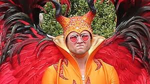 Taron egerton and costume designer julian day discuss rocketman fashions, from iconic dodgers uniform to donald duck. Taron Egerton Talks Crazy Costumes In New Elton John Biopic Rocketman Exclusive Entertainment Tonight