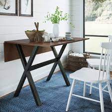 This farmhouse style folding table can be used in your entryway or as a sofa table with its charming off white antique legs. Amazon Com Nathan James Kalos Solid Wood Drop Leaf Folding Kitchen Farmhouse Dining Room Or Space Saving Console Table And Desk Rustic Dark Brown Black Tables