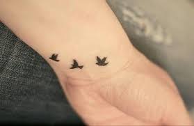 Dove Tattoos For Womens Three Tiny And Cute Red Star Cute Girly Tattoo Smalltattoosforwomen Bird Tattoo Wrist Neck Tattoo Bird Tattoo Collarbone