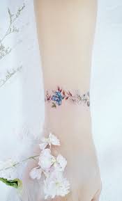 Discreet And Charming Wrist Tattoos You Ll Want To Have Classy Colorful And Feminine Wrist Wrist Bracelet Tattoo Wrist Tattoos For Women Flower Wrist Tattoos