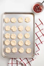 Drop dough by rounded teaspoonfuls onto ungreased cookie sheet (use parchment paper), and about 2 inches apart; 4 Ingredient Jam Thumbprint Cookies The Ashcroft Family Table