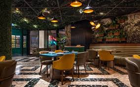 Man caves and home bars. China Grey Marble Base Dining Table Set With Blue Wood Top With Dark Grey Leather Chair With Bronze Armrest Wood Legs China Marble Base Table Wood Table Set