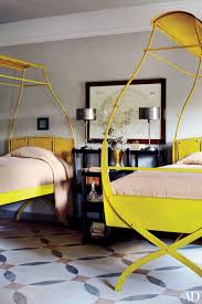 Boasting pintuck accents, the quilt is a welcoming layer. Why You Need A Canopy Bed Architectural Digest