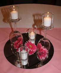 Wine Glass Centerpieces At The Burgundy Basin Without Pink Flowers Maybe White Instead Wine Glass Centerpieces Wine Glass Decor Glass Centerpieces