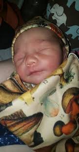 I've seen alot of people sharing their cute little babies in mushroom stuff  so here's my contribution. My sweet sweet rainbow baby Iridian phae in his  mushroom swaddle 🥰🌈💚 (he was 1