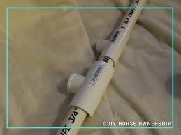 My horse barn is a compact space, with enough room to tie two horses for harnessing or saddling as the rest of the space has been converted to goat pens. Diy How To Make A Swiveling Pvc Saddle Pad Rack Diy Horse Ownership