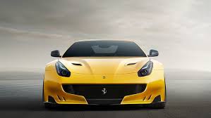 Enzo ferrari was said to have been born on 18 february 1898 in modena, italy and that his birth was recorded on 20 february because a heavy snowstorm had prevented his father from reporting the birth at the local registry office; Hd Wallpaper Ferrari F12 Yellow Supercar Front View Wallpaper Flare