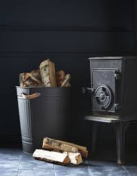 Next To A Fireplace A Knodd Bin With Leather Handles Holds Firewood Ikea Hack Firewood Storage Firewood Storage Indoor