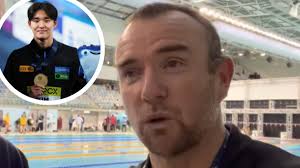 Australian swim coach Michael Palfrey declares allegiance to Korean star  Kim Woo-min in TV interview