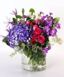 I was just tasked with making this loose and airy tabletop arrangement. Lovely English Garden Style Floral Designs Kittelberger Florist