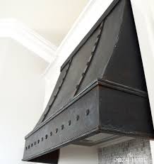 It would add more warmth to the kitchen and tie in with the floating shelves and wood beams. Remodelaholic How To Diy A Custom Range Hood For Under 50