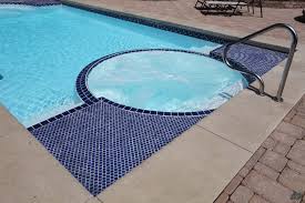 The hot tub can be added on a different level at poolside. Fiberglass Pool Guyz Benefits Of Owning A Fiberglass Spa