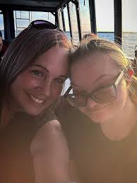 Would someone edit the photo so that Ariana Grande is swimming with me?