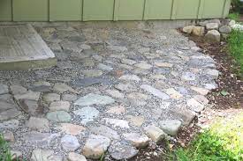 I also build a small retaining wall with landscaping blocks a. How To Lay A River Rock Patio A Traditional Life