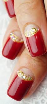 Red carpet manicure puts the tools of the trade right in your hands. Bright Red Enamel With Gold Studs Designs Red And Gold Nails Gold Nails Red Nails