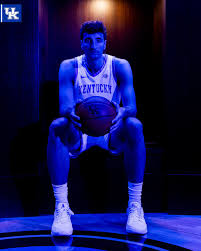 FIRST LOOK: Milan Momcilovic putting on the Kentucky uniform for the first  time. “Im going to bring a good positivity to the court, and a good  personality. I'm also going to bring