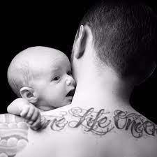There is a saying that having kids means a mom's heart walks around outside her body, so we love this as a nod to that idea. Dad Tattoos For Their Kids Popsugar Family