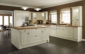 Cream kitchen backsplash emphasizes on smooth feeling for this kitchen part. Dark Floors Cream Cabinets With Oak Wood Kitchen Cabinet Design Best Kitchen Cabinets Kitchen Cabinet Trends