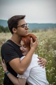 Man Hugging Woman On Flower Field Hug Pictures Man Hug Passionate Couples