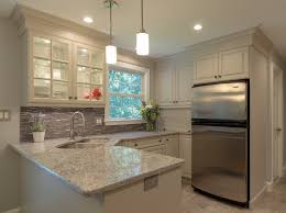 To go contemporary, pair your white cabinets with black hardware. Off White Kitchen Remodel With Improved Storage Space In Acton Ma