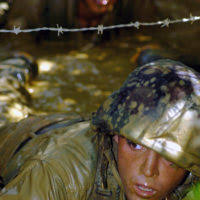 US Navy (USN) Seabee Builder Construction (BU) Marc Verno measures the  trench depth as Construction Electrician 3rd Class (CE3) Justin Nice  operates the wacky packer. Mobile Construction Battalion 7 (NMCB-7) is  conducting