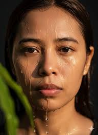 Portrait of a person with a drenched face