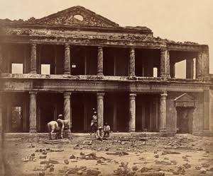 Lucknow, India: the Secundra Bagh showing damage done during the Indian Rebellion; skeletons of murdered Indian rebels lie on the ground. Photograph by Felice Beato, ca. 1858. | Wellcome Collection
