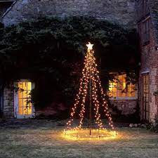 A Cup Of Jo Home Inspiration Outdoor Tree Outdoor Christmas Tree Alternative Christmas Tree Decorating With Christmas Lights