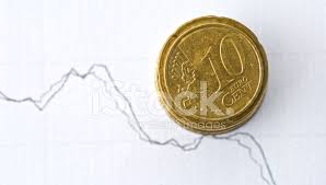 euro coins and stock chart as currency exchange concept