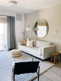 Decorating My First Apartment A Lesson In Budget Friendly Classic Pieces And Creating Moments In 2021 Decorating My First Apartment Living Room Decor Apartment Apartment Decorating Living
