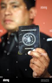 Percy Abrams, Iroquois Nationals lacrosse team board of directors executive  director, shows his Haudenosaunee, or Iroquois Confederacy, passport during  a news conference in New York, Wednesday, July 14, 2010. The U.S. government