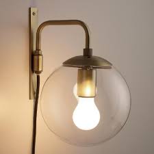 Brighten Any Corner With Our Exclusive Globe Wall Sconce Crafted Of Glass With A Dark Brass Bracket And Fi Wall Sconce Lighting Brass Wall Sconce Wall Sconces