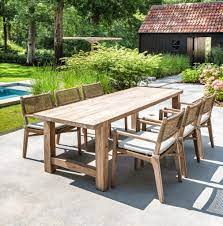 Reclaimed teak extending table and natural wicker chair set. Gommaire Reclaimed Teak Outdoor Furniture Luxury Outdoor Living