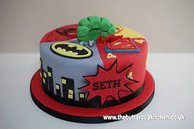 A modern design chocolate cake covered by chocolate mousse and coco spray. Birthday Cake For A Superhero Themed Party Batman Spiderman Ironman And Superman With A Hulk Fis Superhero Birthday Cake Boy Birthday Cake Superhero Cake