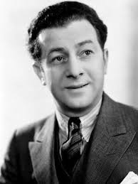 Who are the individuals in the photo with Groucho and Phil Silvers?