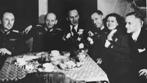 German fall dinner party pork schnitzel with a mustard beer. Oskar Schindler Center Enjoys Himself At A Dinner Party In Krakow With German Army Officers Collections Search United States Holocaust Memorial Museum