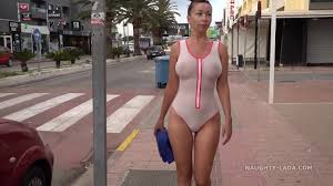 Naughty Lada wears see-through swimsuit in public beach - XNXX.COM