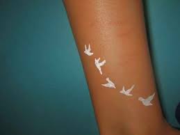 This makes to be one of the most attractive tattoos that. White Ink Tattoos On Tan And Dark Skin Tattoos Spot