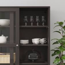 The cabinet includes sliding glass doors with tempered glass panels and brushed metal door pulls. Havsta Storage With Sliding Glass Doors Dark Brown 95 1 4x18 1 2x83 1 2 Ikea