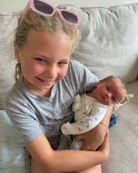 One week of pure magic with baby brother 💙✨🥹 The girls are seriously  obsessed. We have to have a schedule so we don't fight about who holds him.  I am worried he