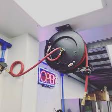 Mount Your Central Pneumatic Retractable Hose Reel Item 93897 89 99 And Set The Ratchet System For The Per Air Hose Reel Retractable Hose Garage Work Bench