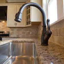 Should i get a brushed nickel kitchen faucet to better match the sink, or an oil rubbed bronze kitchen faucet to match all the rest of the hardware? Other Contmeporary Photos Bronze Kitchen Faucet Oil Rubbed Bronze Faucet Bronze Kitchen